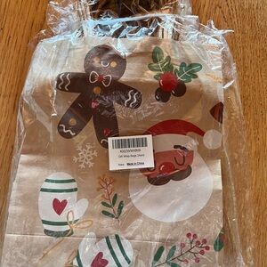 Festive Holiday Gift Bags with Gingerbread and Santa Design